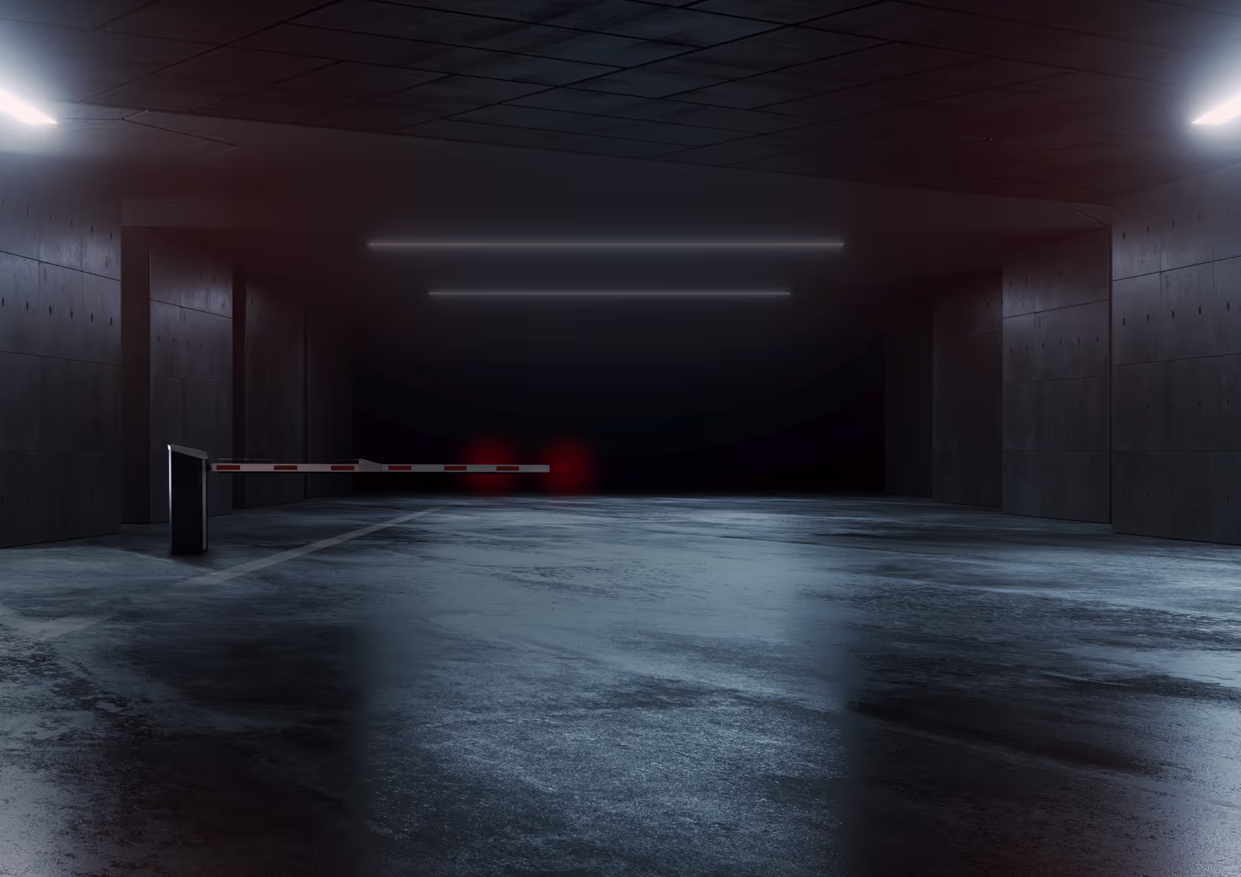 A dimly lit parking garage entrance with a closed barrier blocking access.
