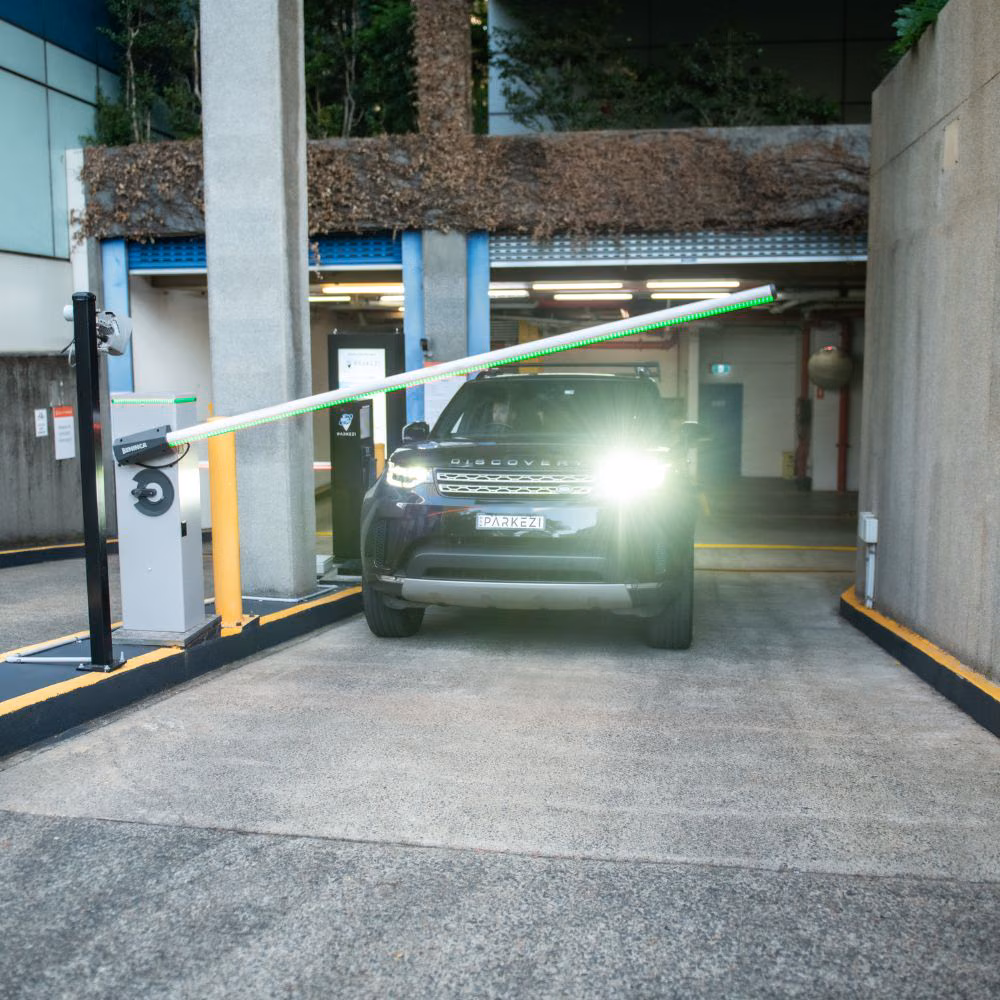 Vehicle exiting through a Parkezi boom gate.